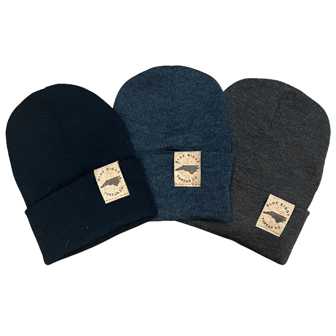 Eco friendly 100% merino wool watchcap beanie with elk cork leather tag available in charcoal, brown, and black