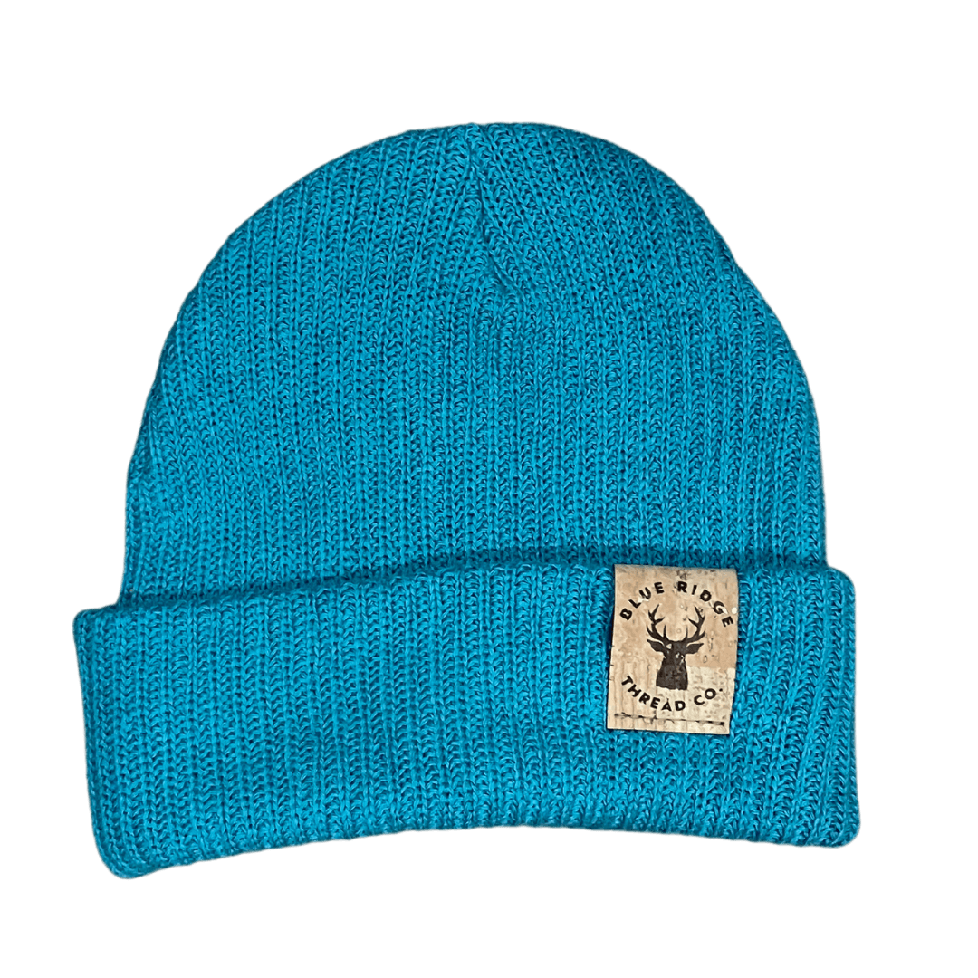 Eco friendly 100% organic cotton beanie in teal with elk cork leather tag