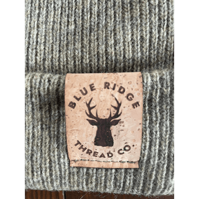 Eco friendly 100% merino wool beanie cork leather patch on olive